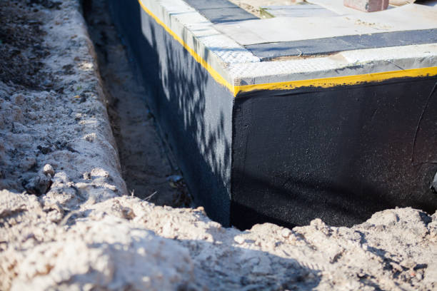 Professional Basement Waterproofing technician working in Wharton, OH